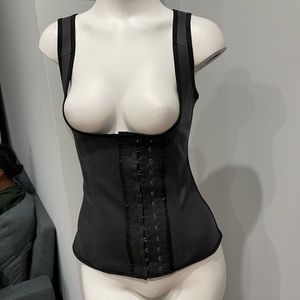 Black latex waist trainer corner